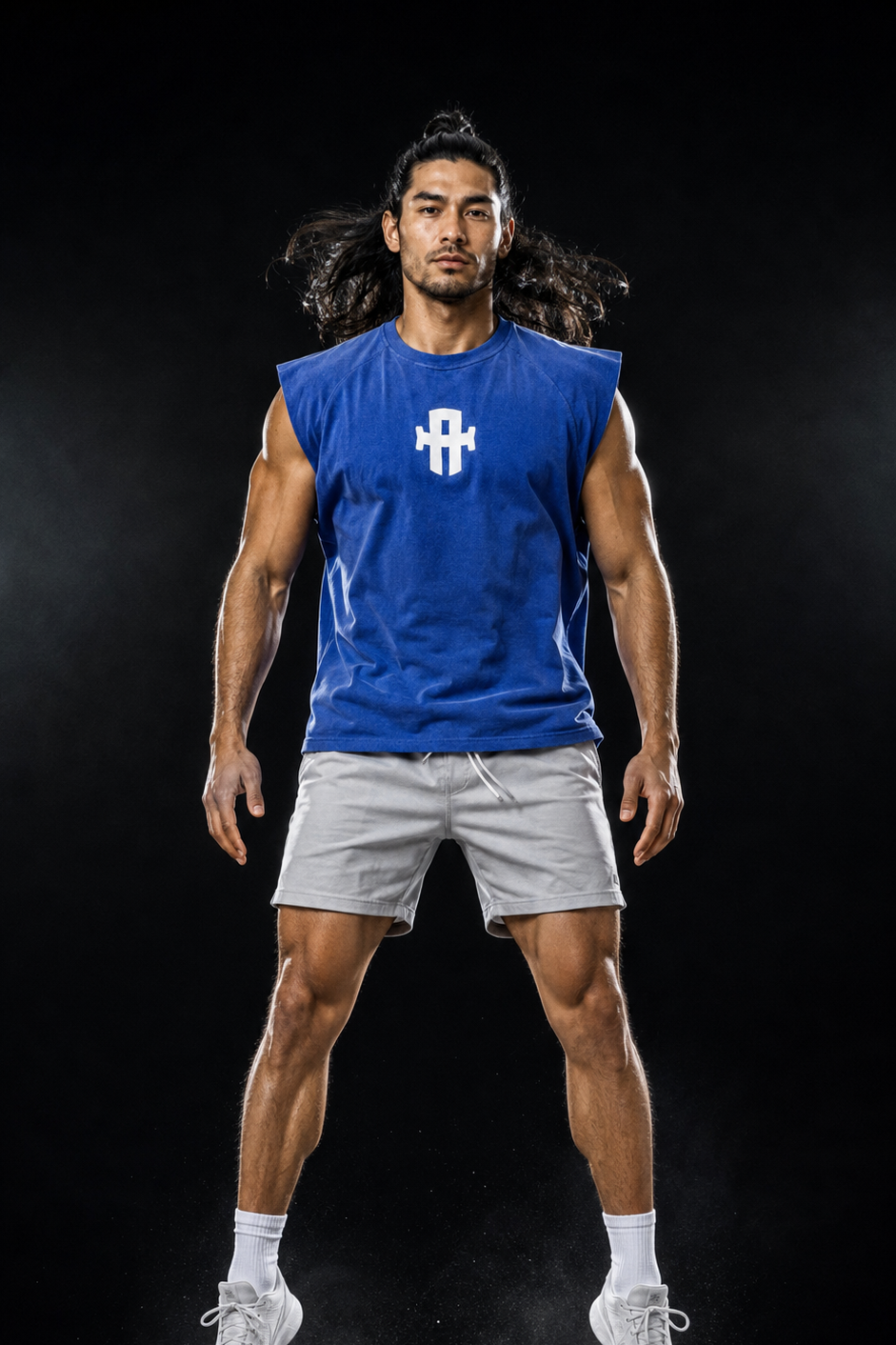 Person wearing a blue sleeveless shirt with a logo on a black background