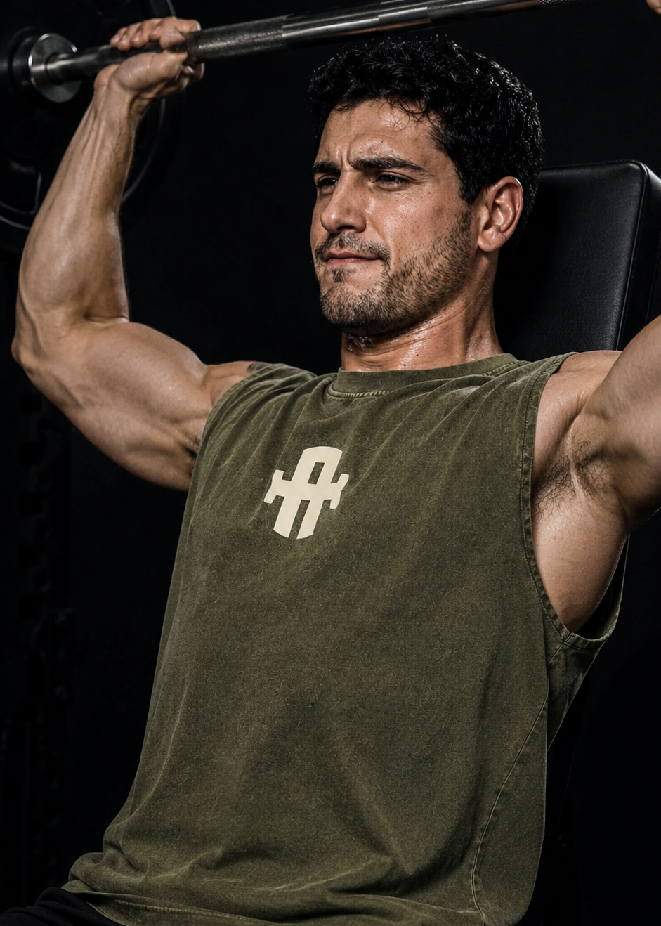 Man lifting weights with a dark background